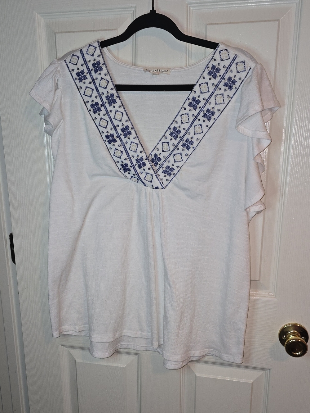 White V-Neck Blouse with Blue Embroidered Trim